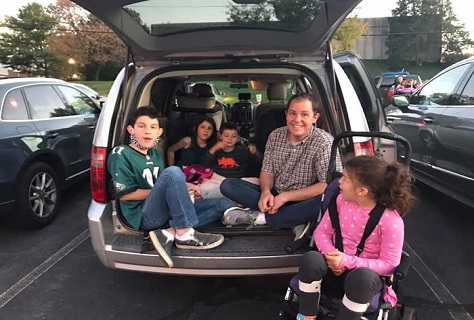 Family Enjoying Sitting in Car Boot
