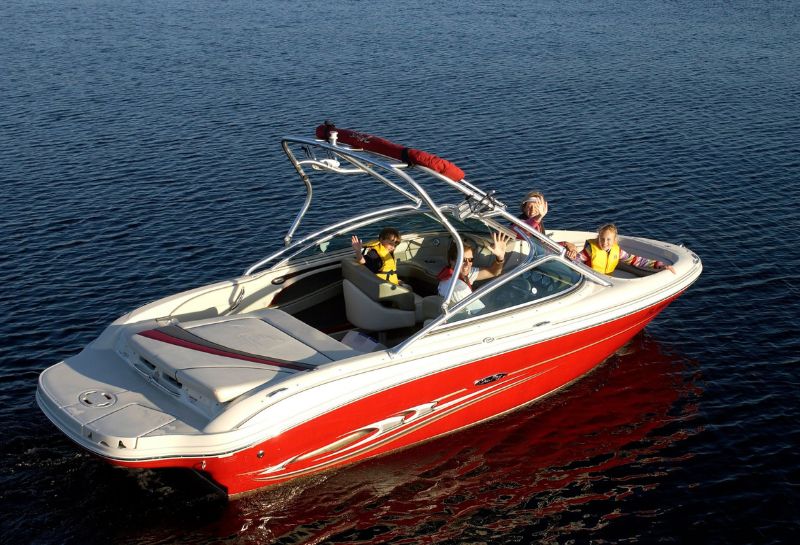 Family enjoying speed boating at a lake