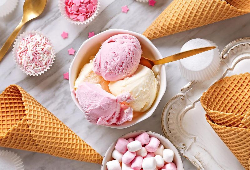 pink and white ice cream scoops served on a table