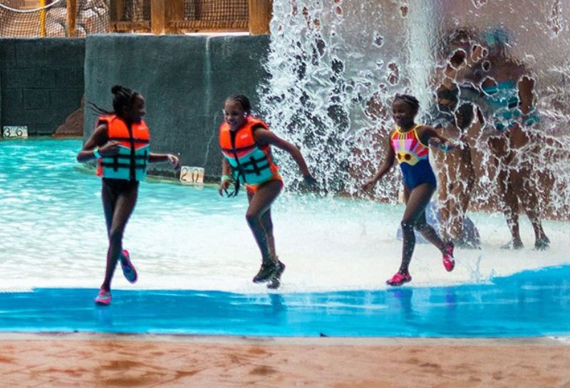 kids running around in their life jackets at the Massanutten Resort and waterpark