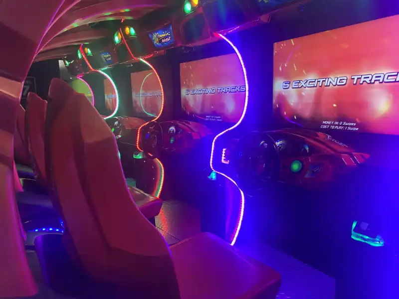 The interior of a car with a Jake's Unlimited video game console.