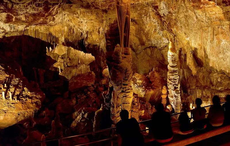 A group of people exploring the breathtaking Kartchner Caverns.