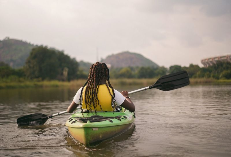 woman kayaking in river
