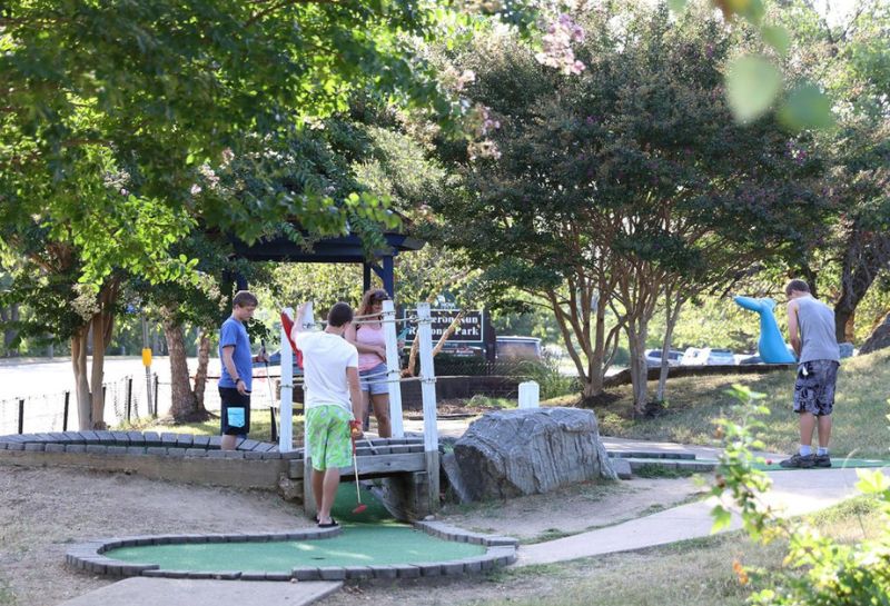 Family playing mini golf at Cameron Run Regional Park