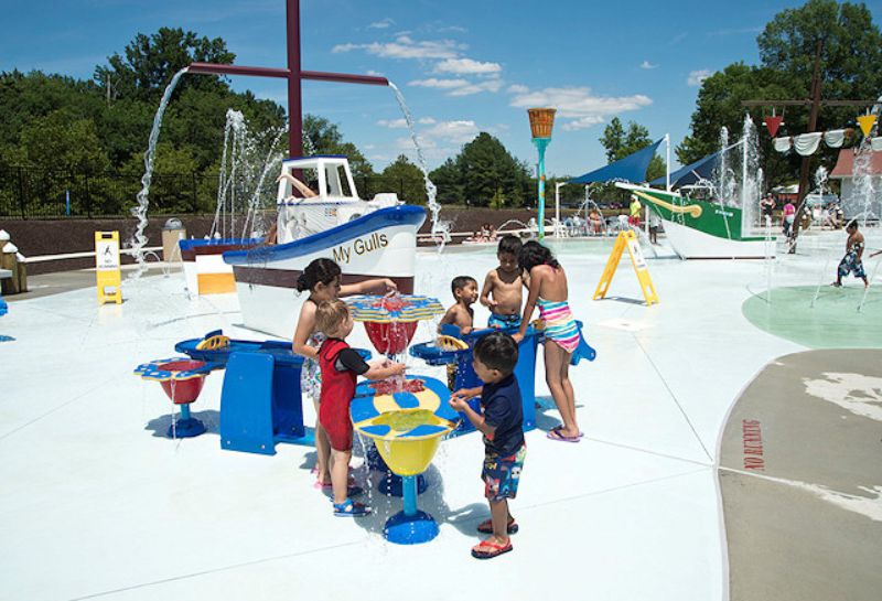 kids playing at the Our Special Harbor Spray Park