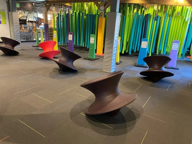 A group of colorful chairs in a room.