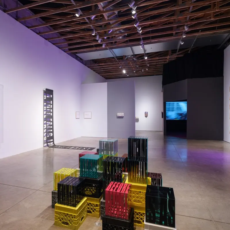 An art gallery with colorful blocks on the floor.