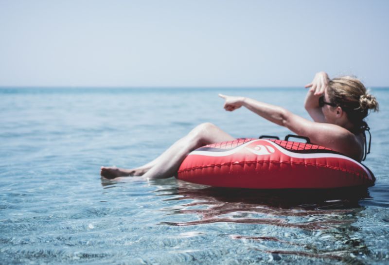 Woman on an inflatable float in river