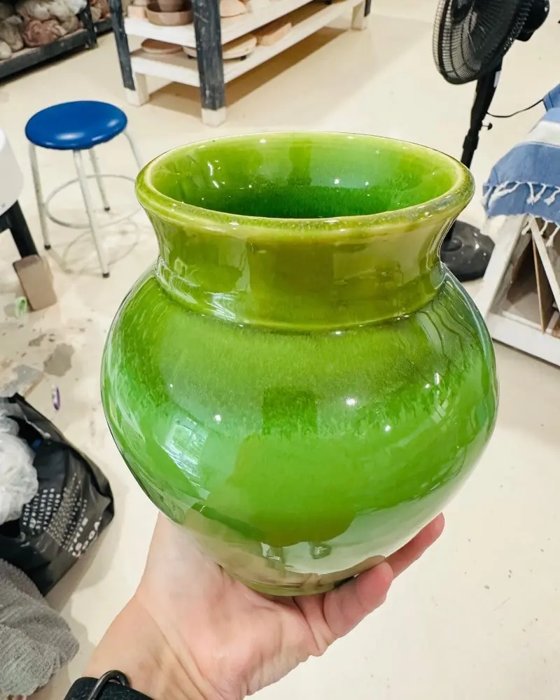 Large green painted vase
