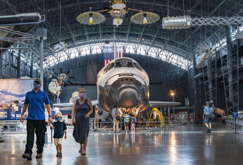 Picture of a family visiting the National Air and Space Museum
