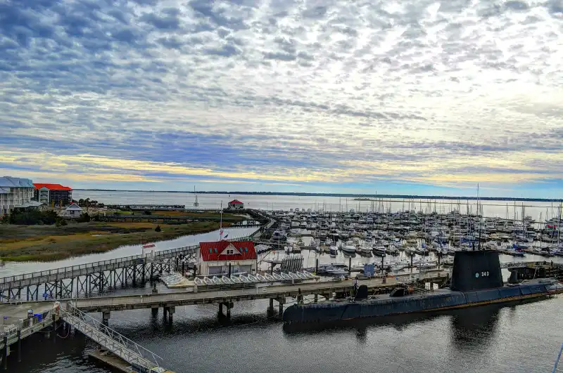 A boat docked at a dock in a marina.