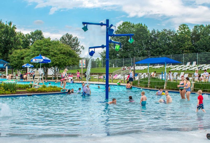 Families swimming inside a pool at Waterworks park 